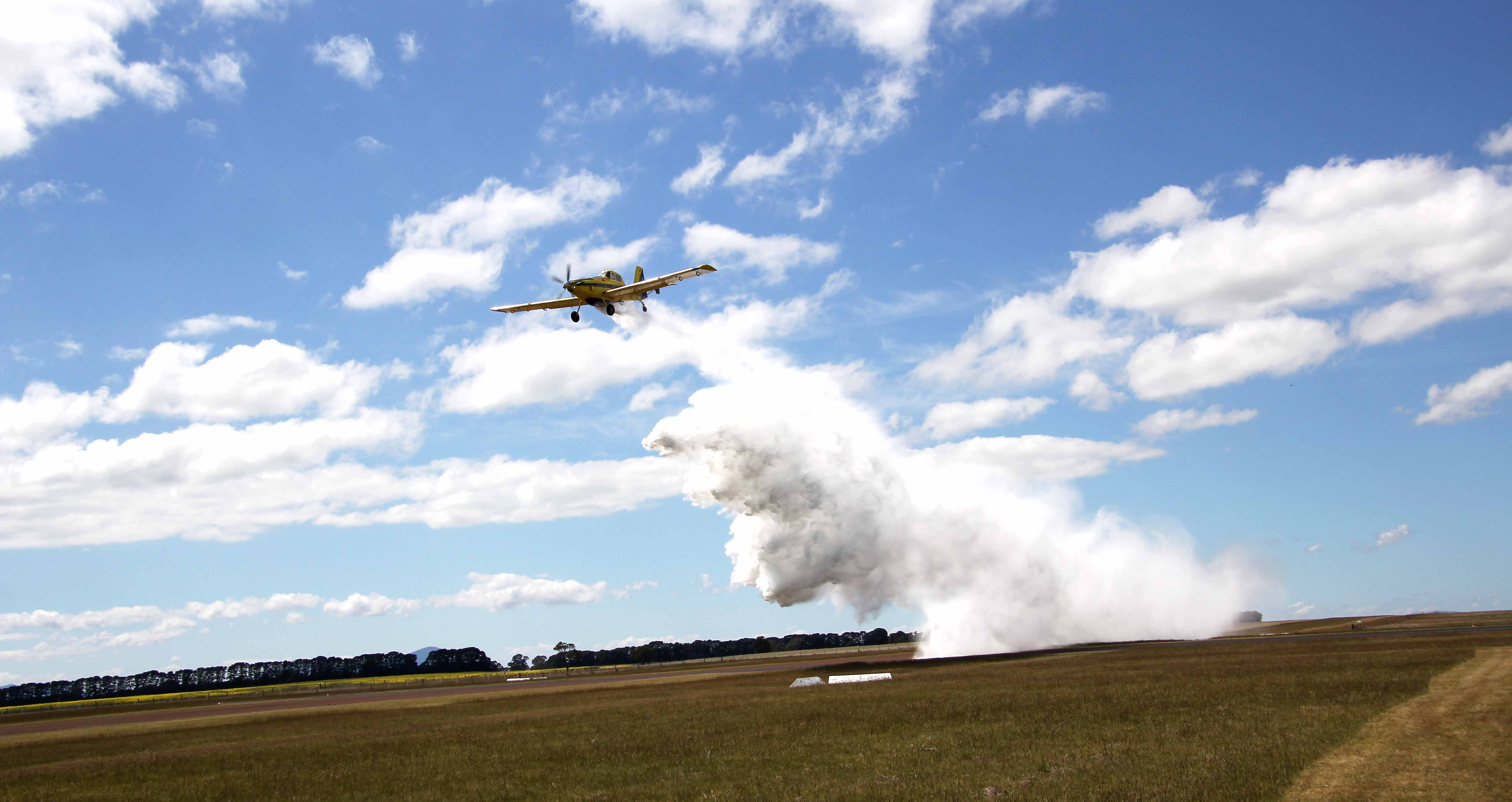 Image of fire bombing plane dropping water