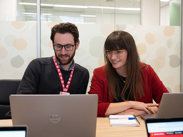 Two CFA staff at the computer